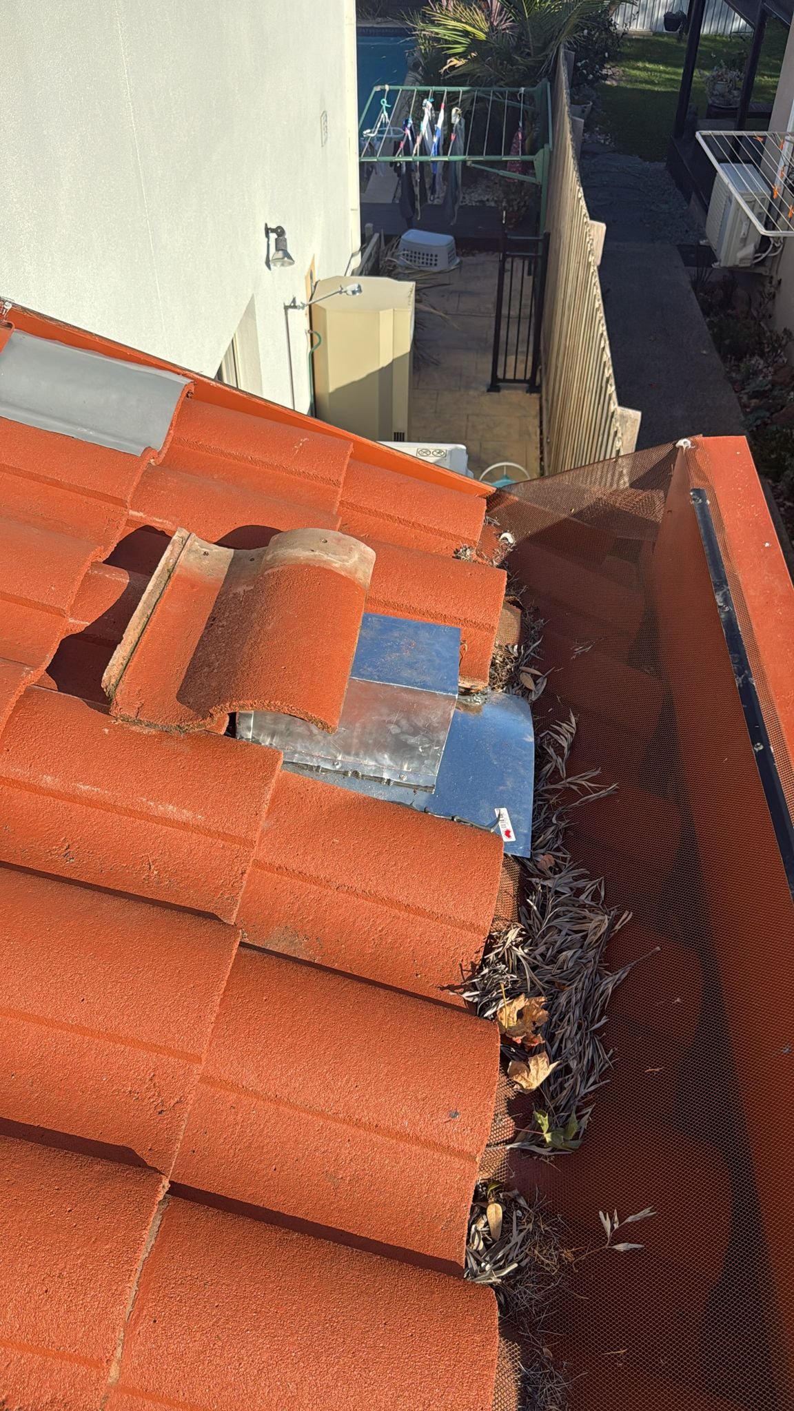 Gutter proofing and one-way door installation in Spanish tiles